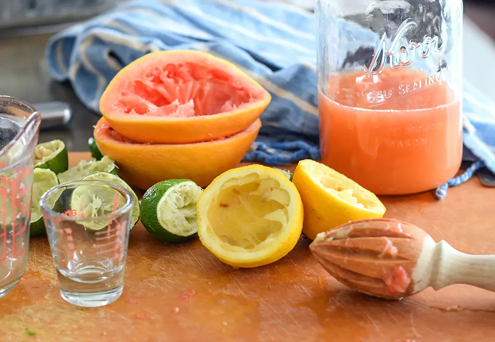 Juice limes, lemons, and grapefruits for margaritas