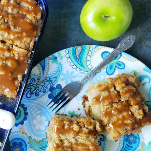 pan of cinnamon rolls with apple
