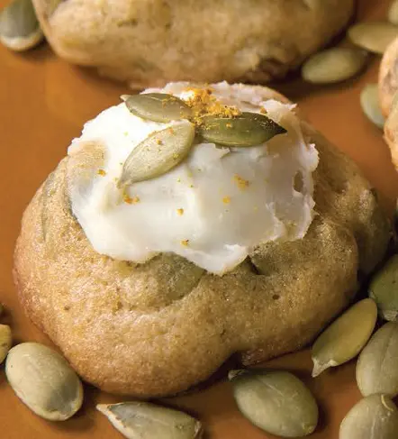 Pumpkin spice and pumpkin seed cookies with frosting on top
