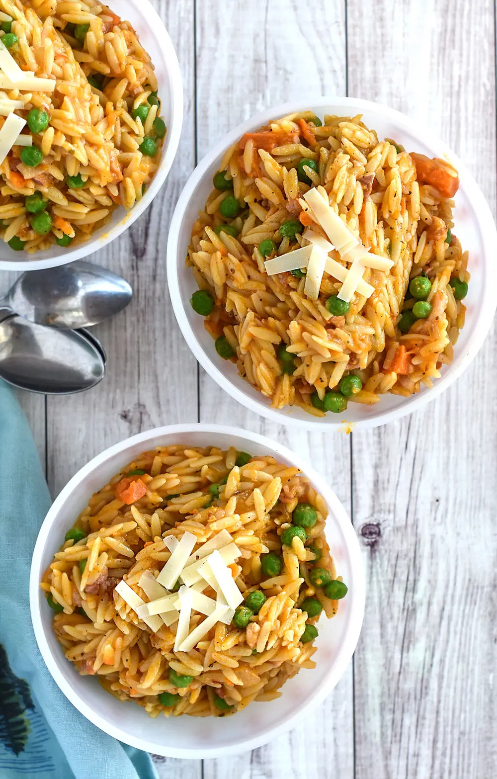 Bowls of sweet potato orzo with peas.