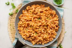 Taco macaroni and cheese in a skillet