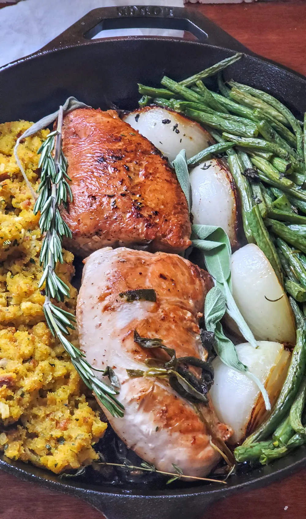 Turkey tenderloin sauteed on the stovetop and then baked in the oven along with veggies, stuffing, and fresh herbs.
