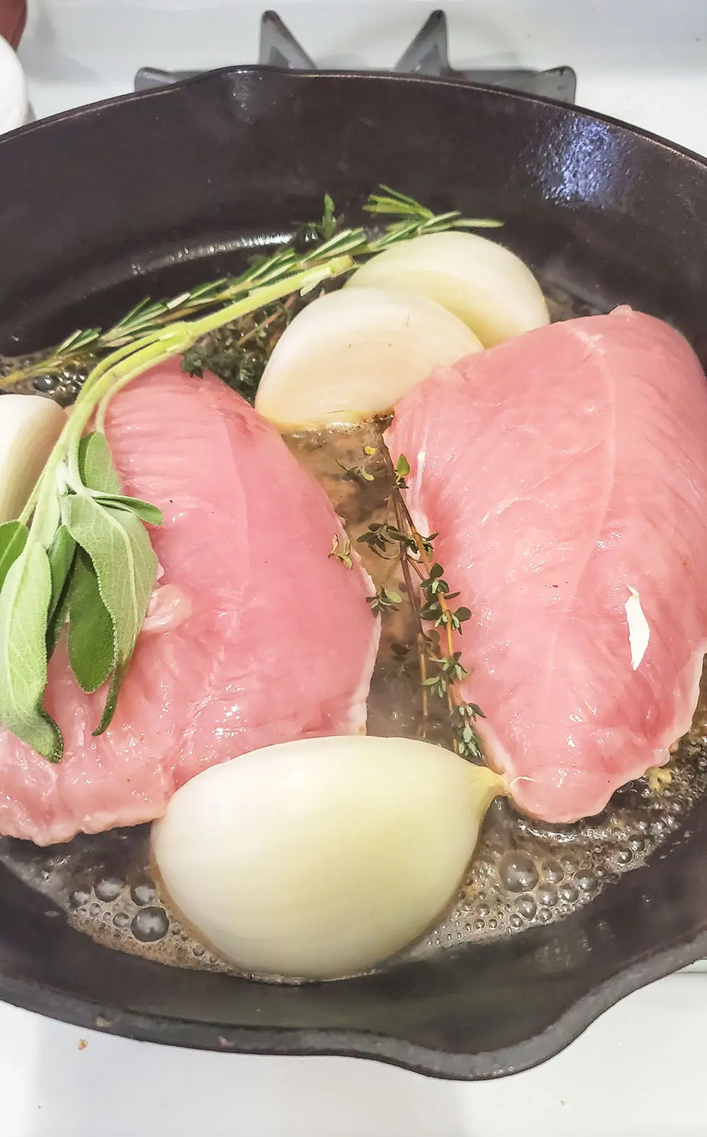 Turkey tenderloin sauteed in a cast iron skillet.