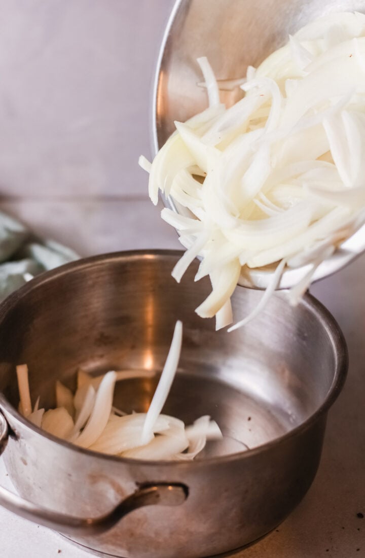 White onions sliced up for onion soup.