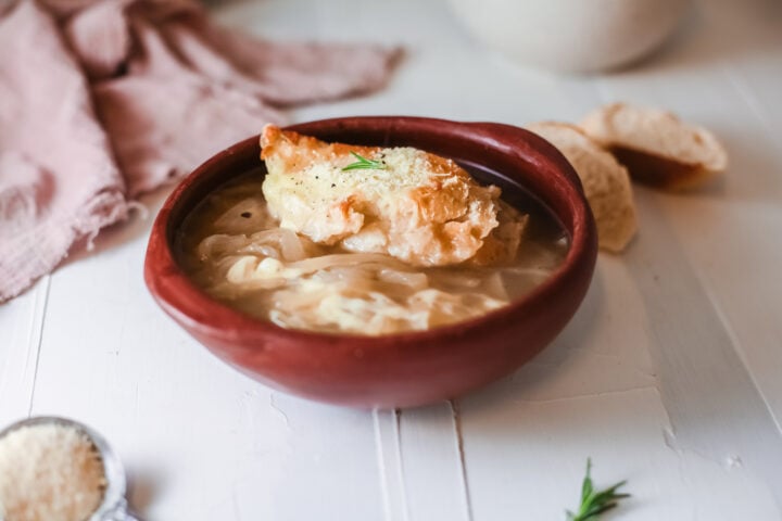 Onion soup in a bowl with bread on top