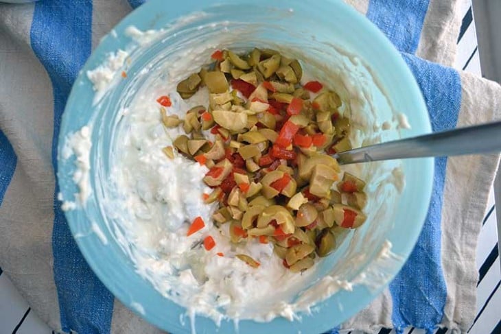 mixing up the olive dip