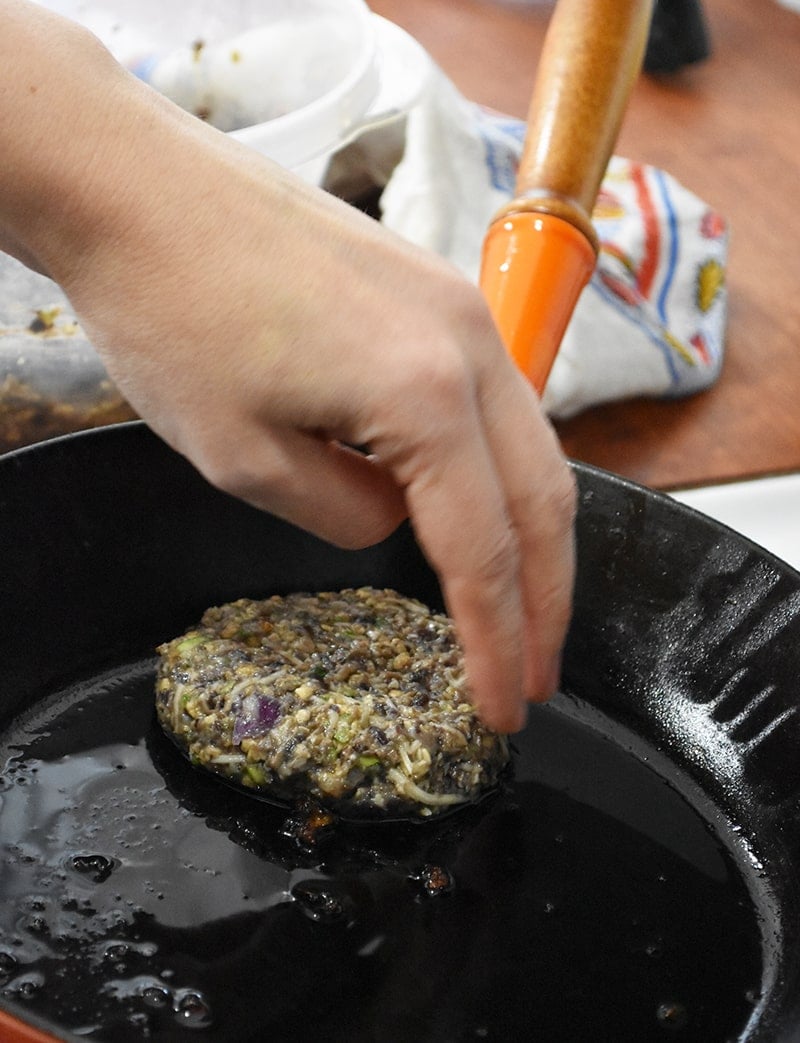 veggie burgers being fried up in the pan. Easy to make and they are fast!