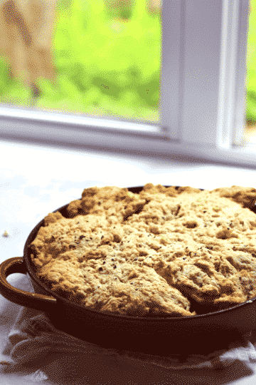 chicken thighs, tomatos, and goat cheese are baked in the oven in this yummy cobbler!