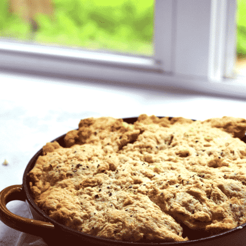 chicken thighs, tomatos, and goat cheese are baked in the oven in this yummy cobbler!