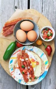 Egg, hummus, and bacon breakfast tacos. Lots of flavor here!