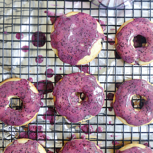 These baked yogurt donuts with fresh blueberry icing are fast and easy for busy parents! Kid's love them because of their sweet and bright blueberry flavor AND fantastic color. You'll love them because you can make them up in under 20 minutes.