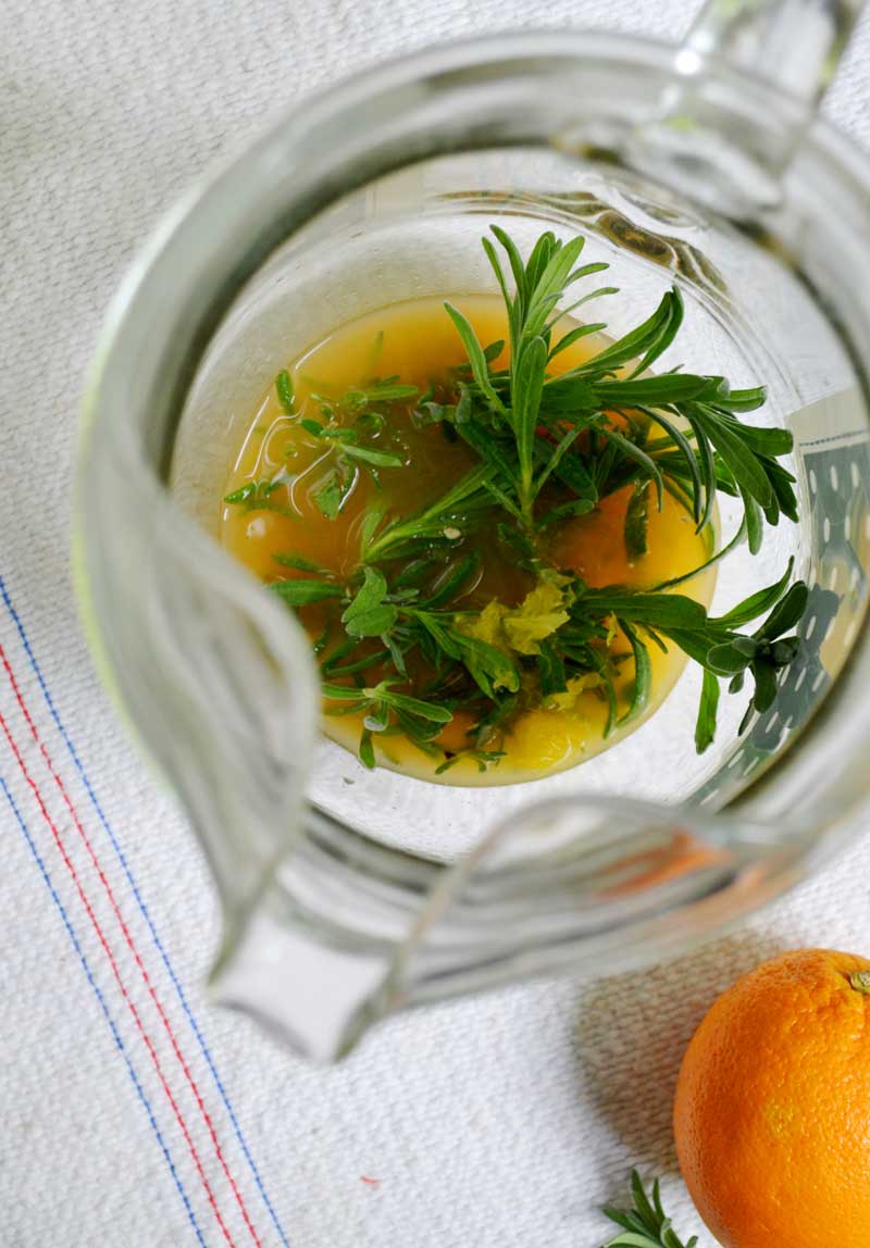 a pitcher of mimosa's with lavender