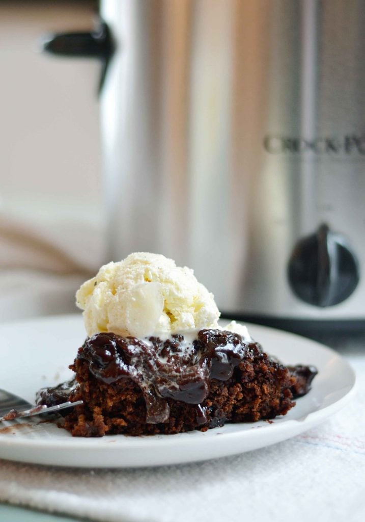 Slow cooker chocolate stout cake with frosting. This cake is crazy easy to make, features Stout to add depth of flavor without crazy sugar amounts, AND it self frosts. REally! The frosting gets all wonderful while the cake is being made.