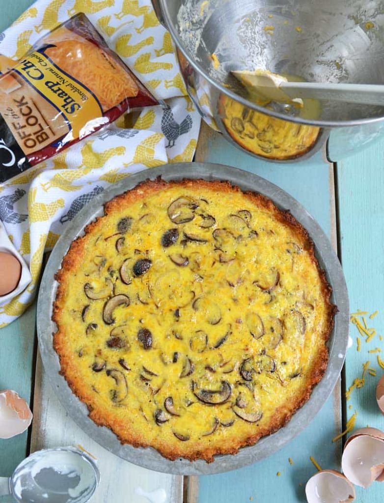 This easy quiche recipe features a cauliflower crust and some favorite farmer's market ingredients, mushrooms and leeks. Recipe from NellieBellie