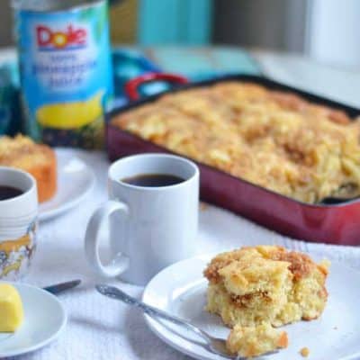 Pineapple coffee cake with coconut crumble. The perfect pairing in this rich and buttery cake perfect for Easter Sunday!