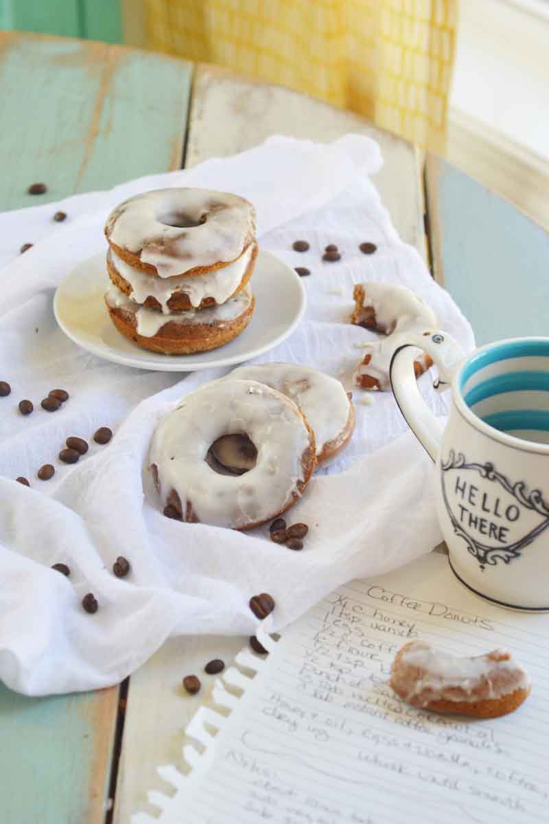 These baked coffee cake donuts are easy to make and jammed with coffee flavor and topped with a bold whiskey icing. The perfect start to your weekday breakfast!