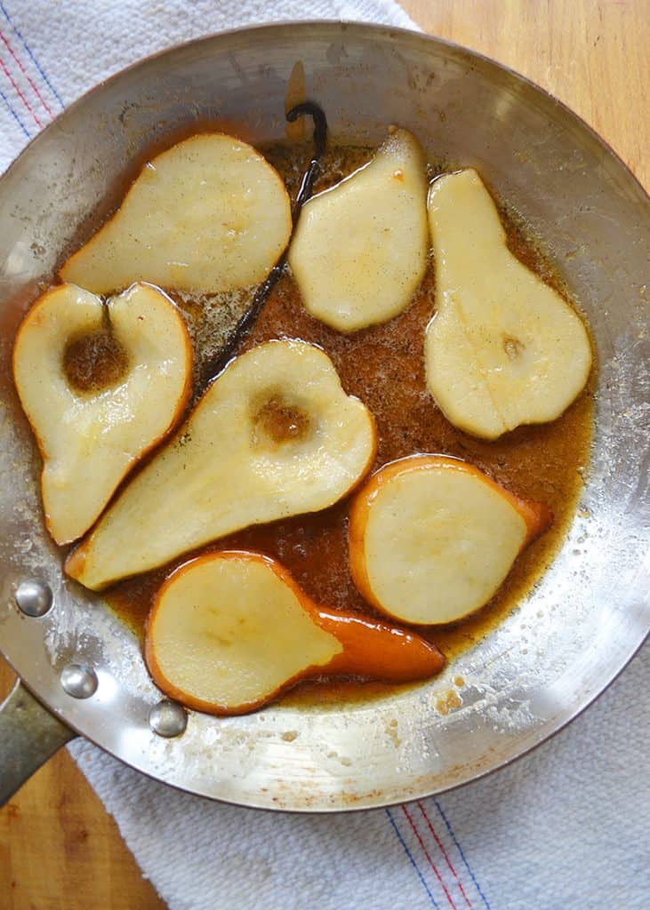 Pears poached with fresh vanilla for pear cake