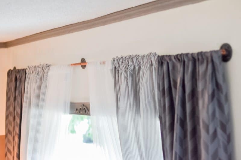 living room makeover - after photo, copper pipe curtain rod 