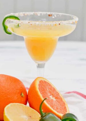 easy margarita recipe with triple sec and tequila. Uses fresh juice from oranges to create the BEST sweet and spicy margarita!