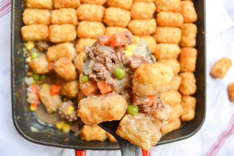 Also called "tater tot casserole", Tater Tot hotDish is a traditional Minnesotan dish complete with a variety of veggies and tater tots on top.