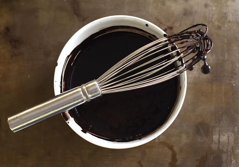 whisking the black cocoa for the chocolate cake