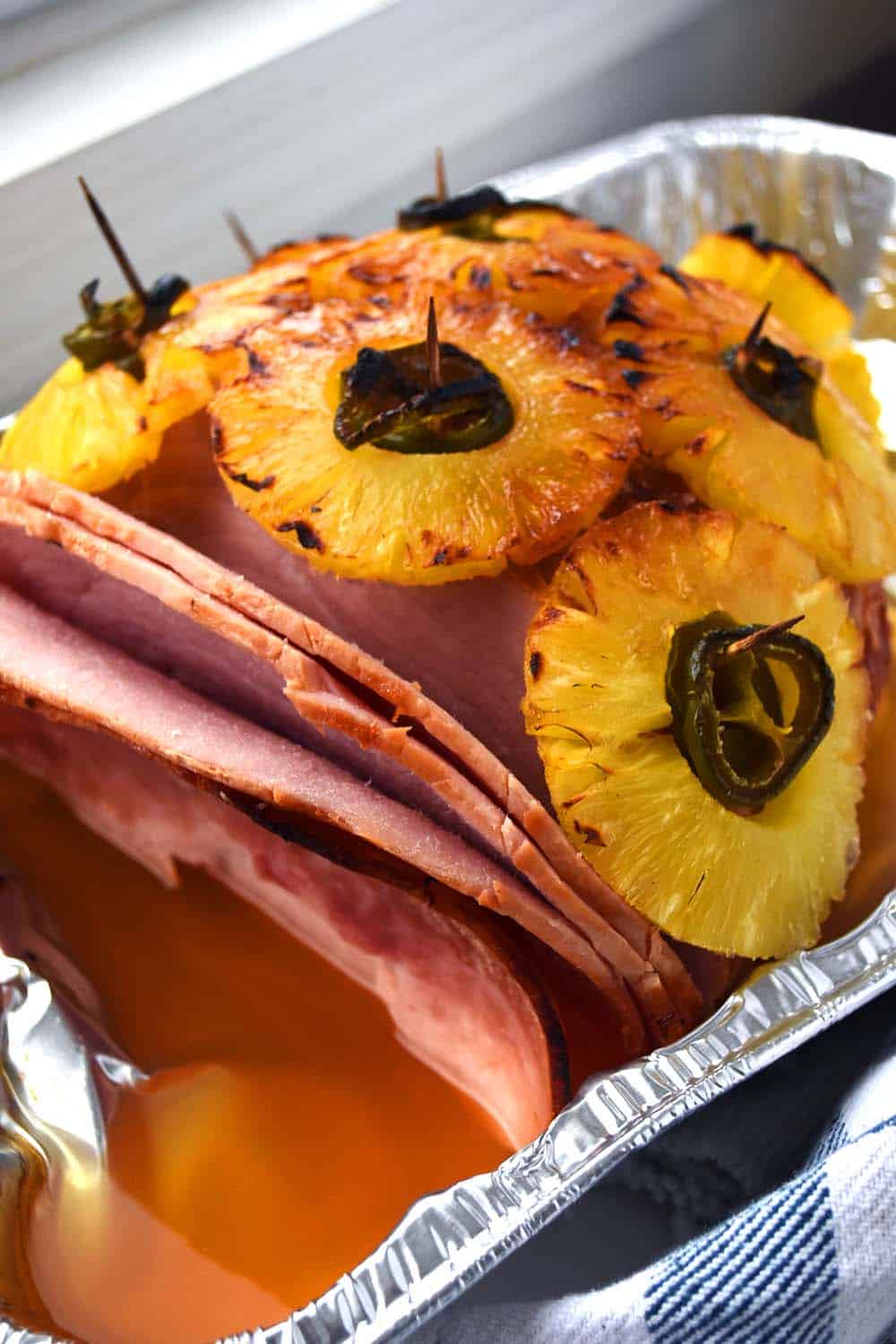 Jalapeno Pineapple ham in an aluminum roasting pan.