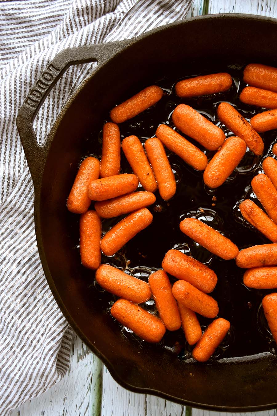 glazed carrots in a cast iron pan