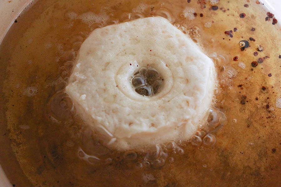 Fry cut biscuits into donuts.