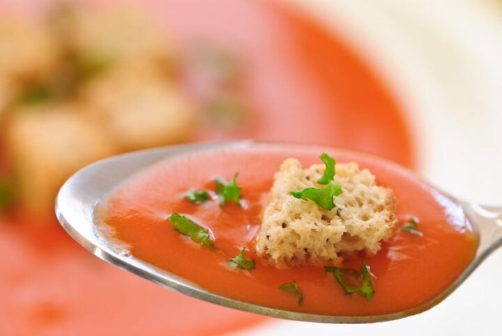 spoonful of leftover tomato soup waiting for storage