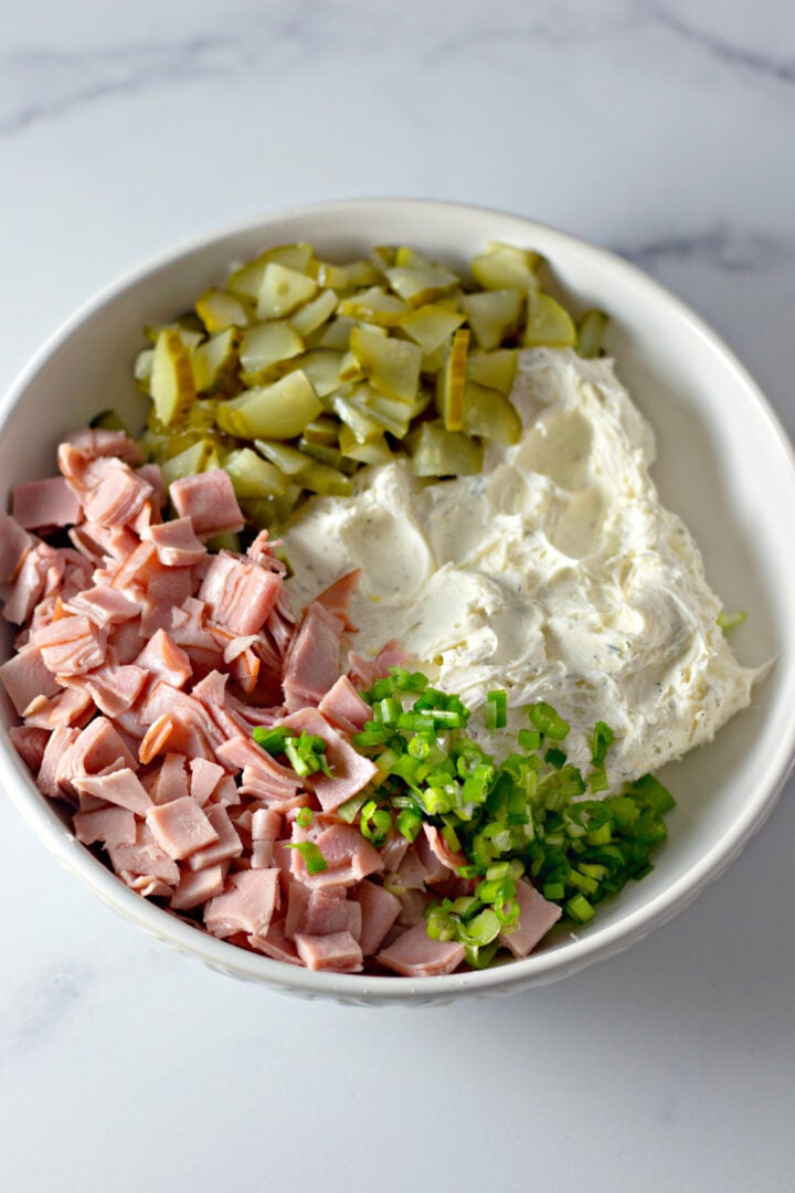 ingredients for dill pickle dip in a bowl