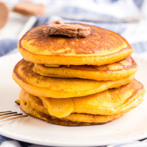 Stack of buttermilk pumpkin pancakes with cinnamon butter