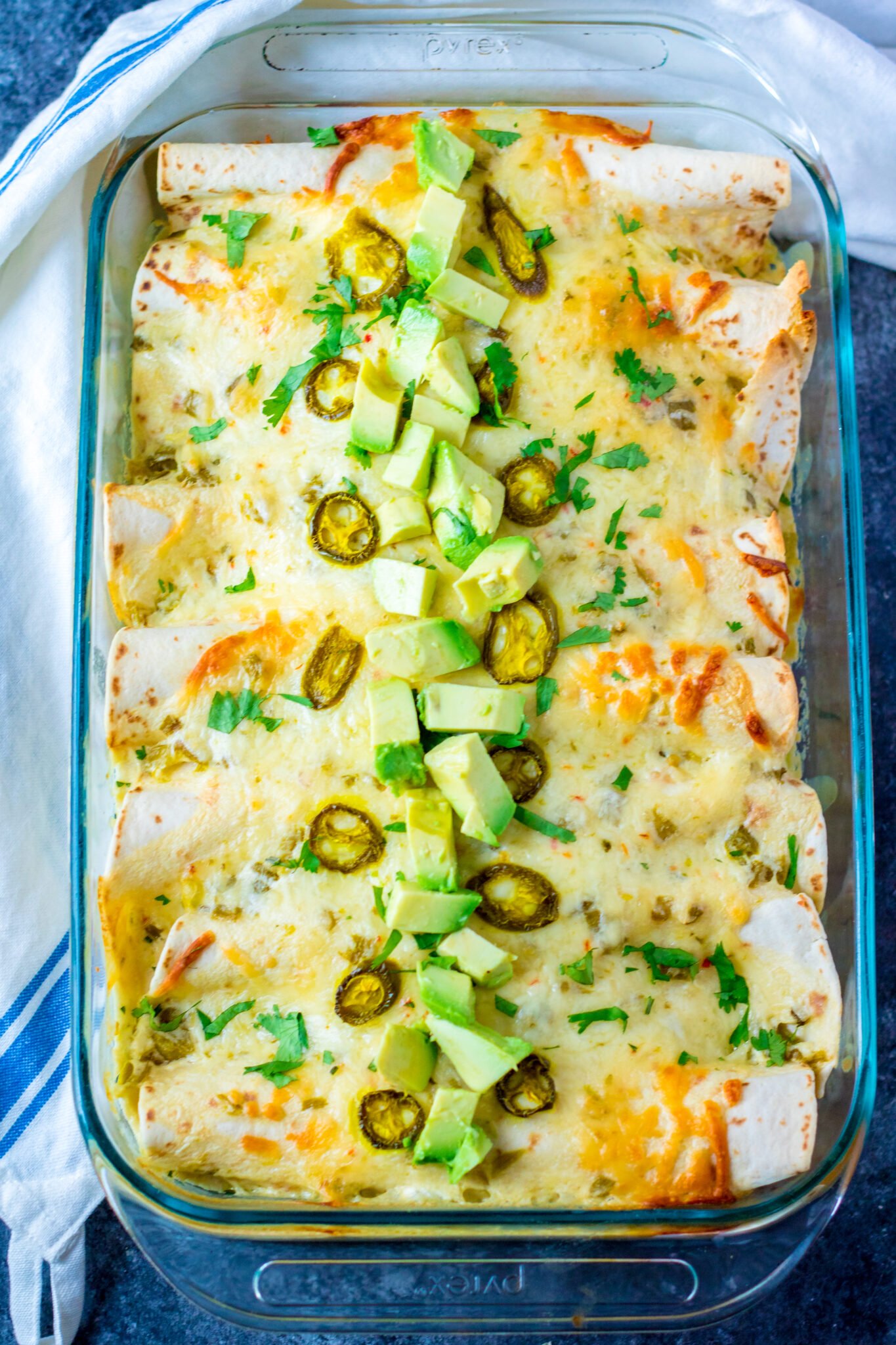 A golden pan of cheesy enchiladas