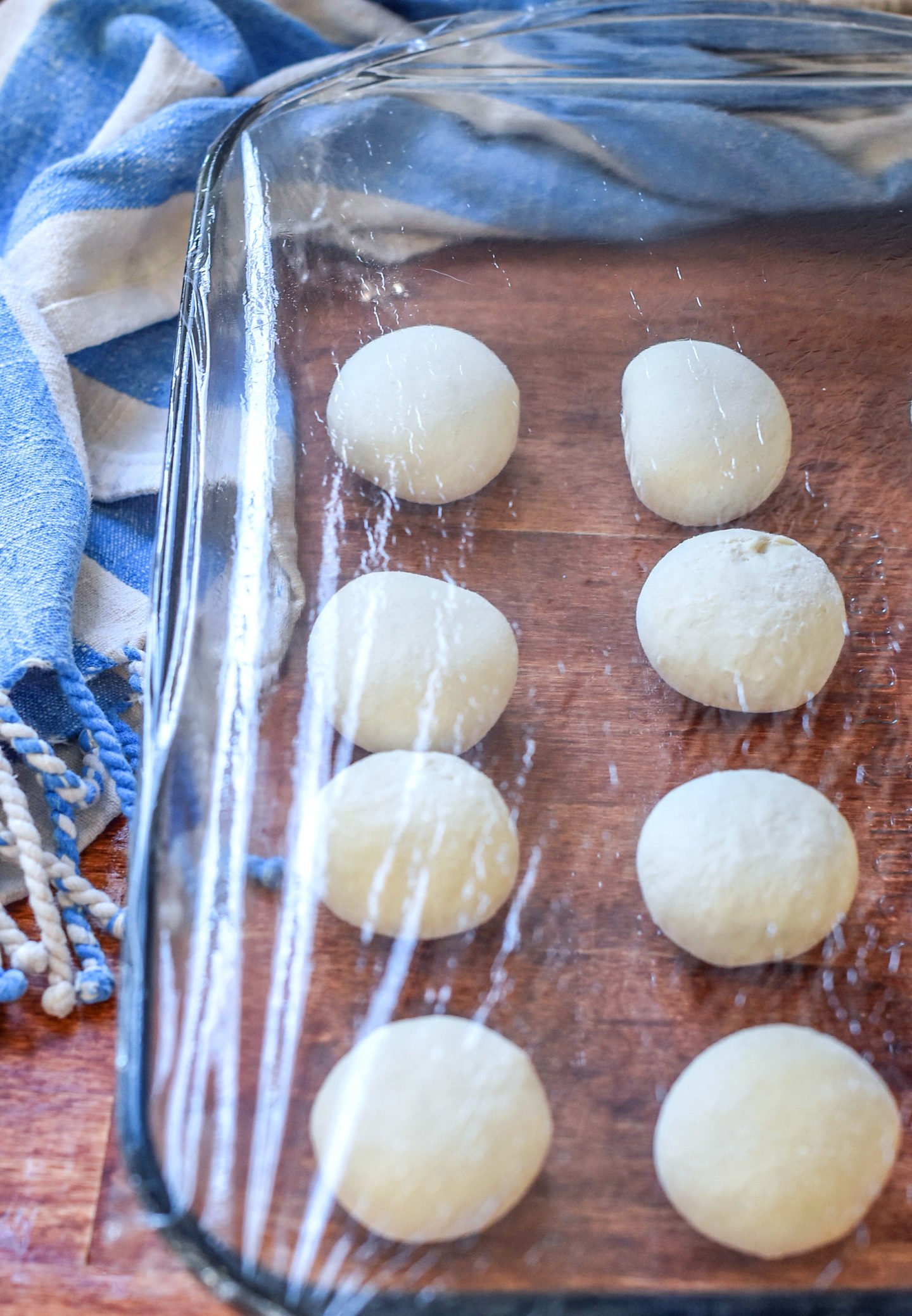 frozen dinner rolls rising in a pan.