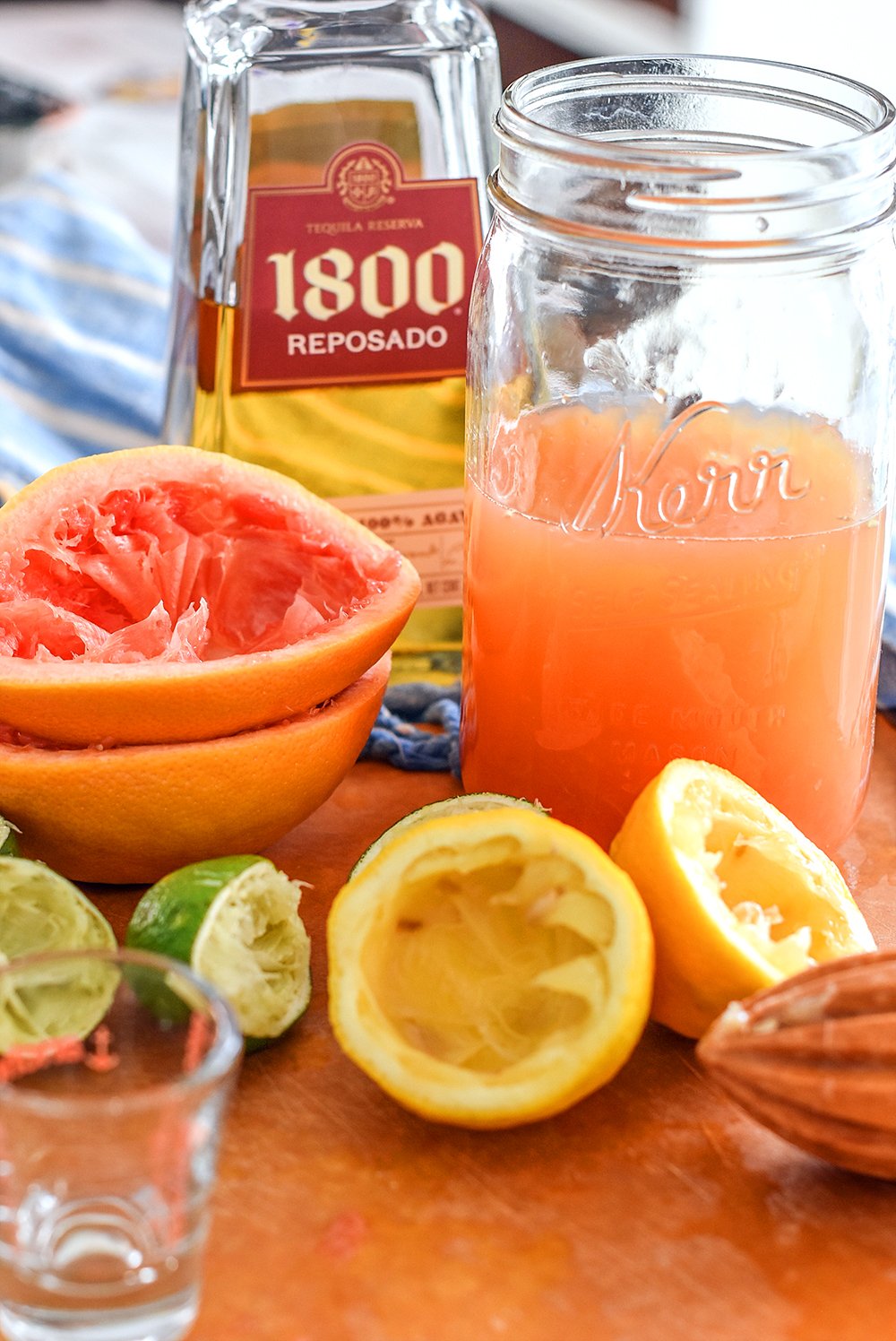 Gold tequila, grapefruit, limes, and lemons for margaritas