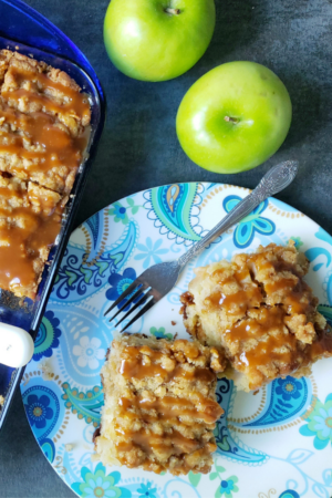 pan of cinnamon rolls with apple