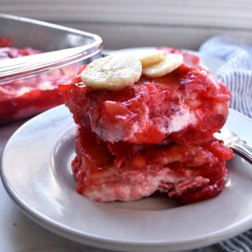 strawberry and banana jello salad on a plate