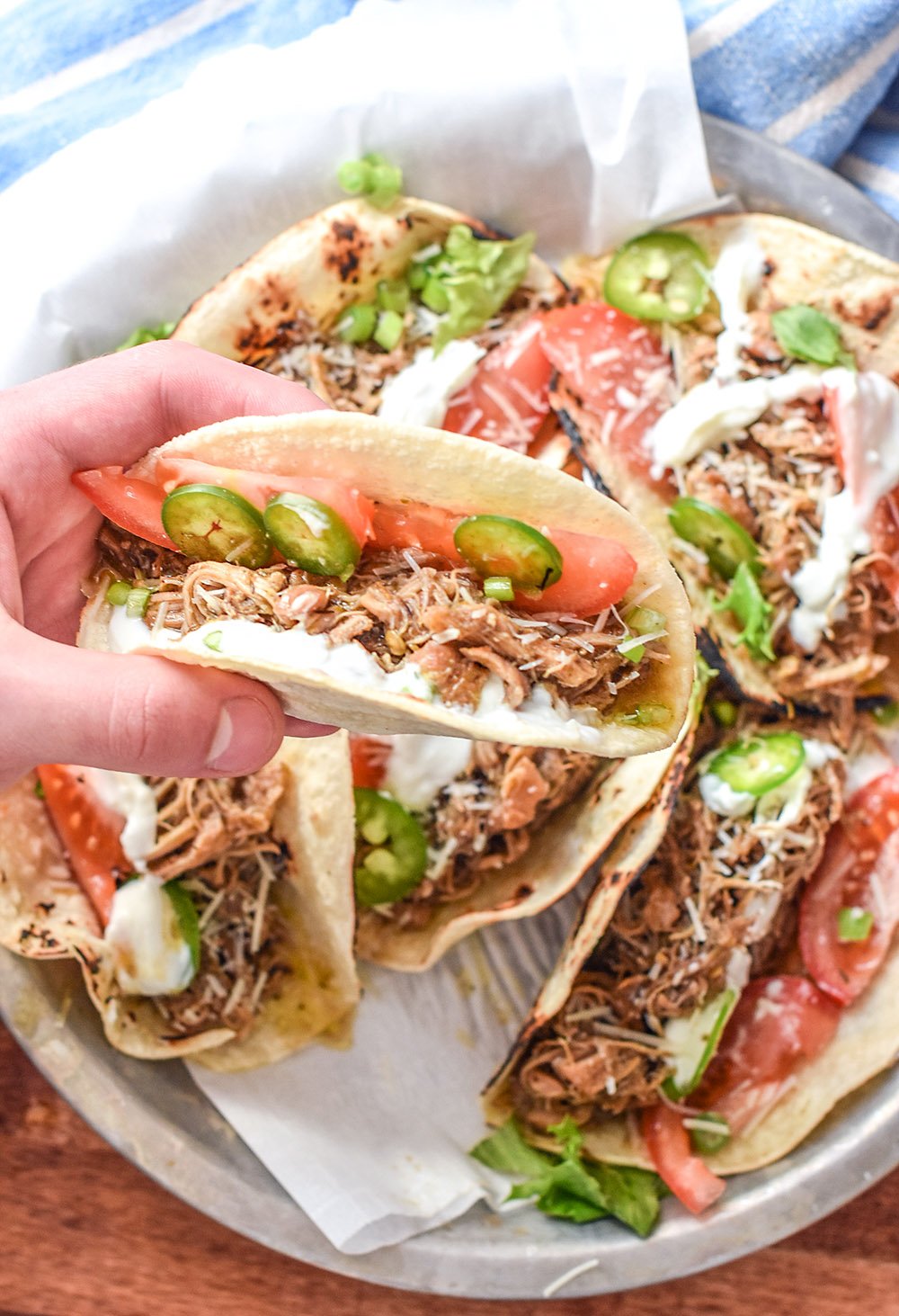 a taco with shredded jerk chicken