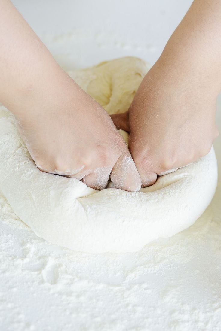 Kneading a loaf of homemade bread