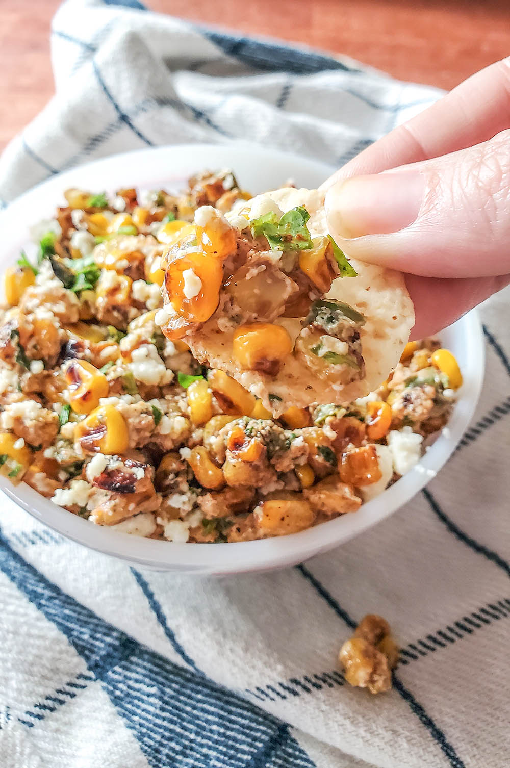 Mexican Street Corn dip full of cilantro, jalapeno, cheese, and yumminess!