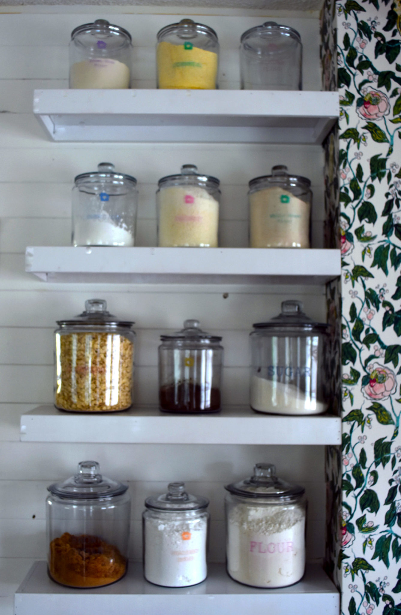 a shelf of glass jar for pantry